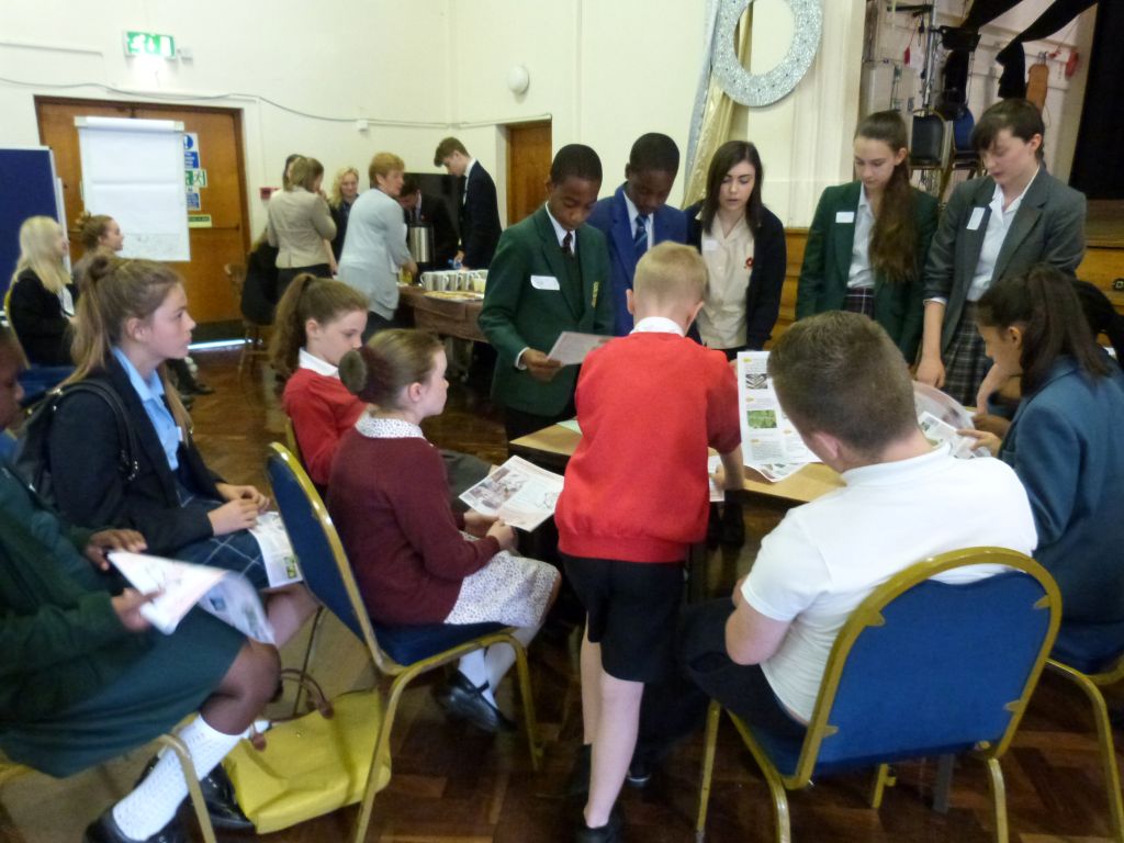 Mixed groups collaborating around tables during The Mix event